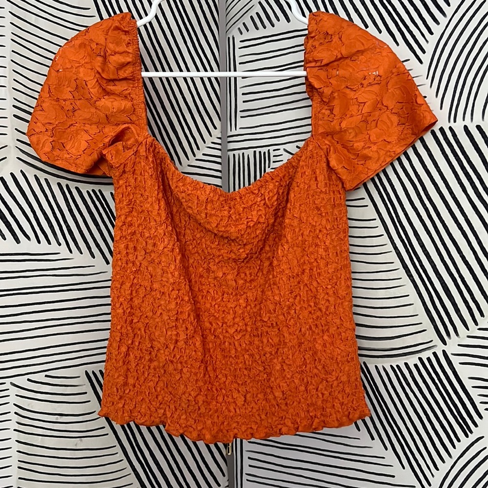 Express orange tank. Can be worn on or off the shoulder.
